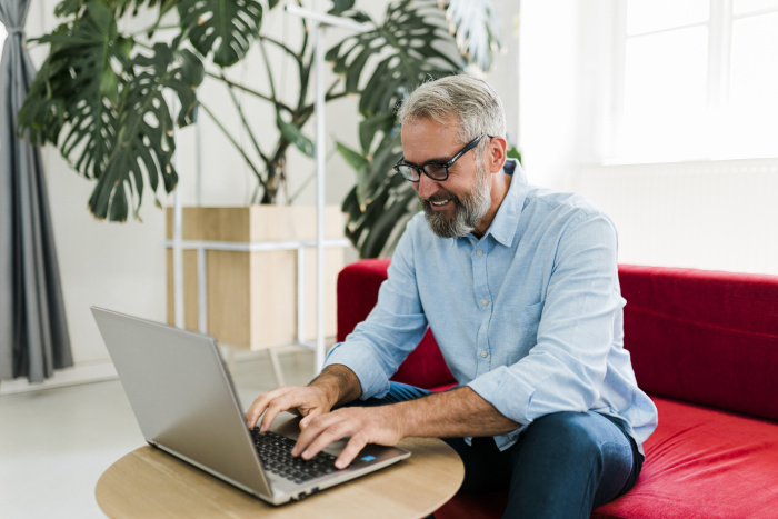 Member on laptop skipping a loan payment