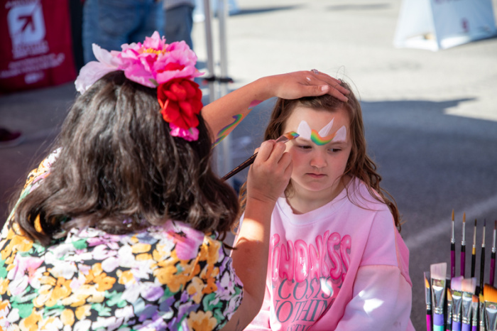 Young member getting face painted at Annual Meeting