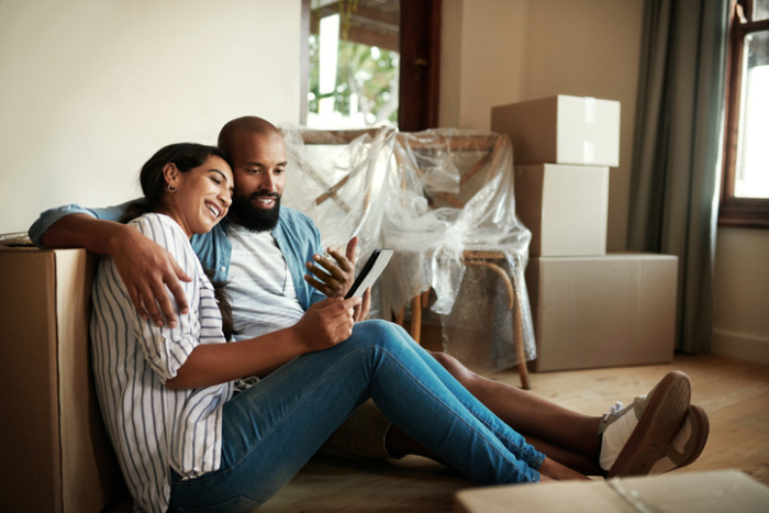 Young couple relaxing after moving in new home