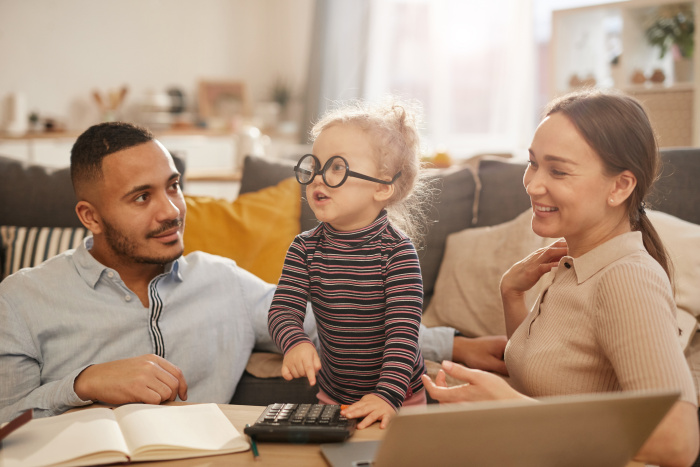 Happy couple reviewing refinance savings