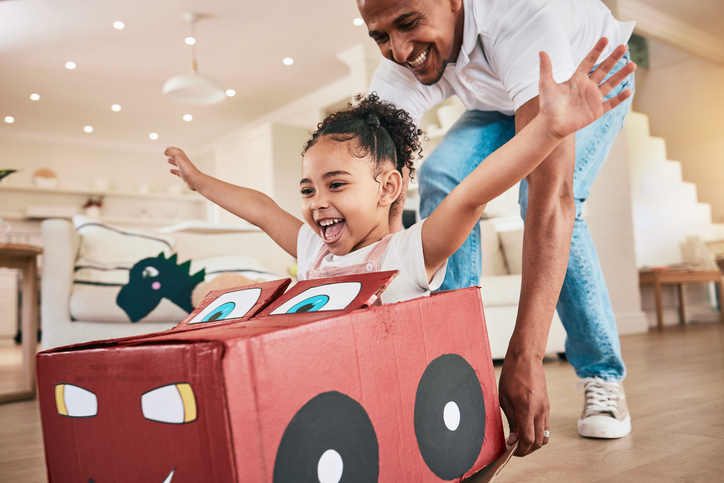Father and daughter enjoying time at home thanks to mortgage refinance